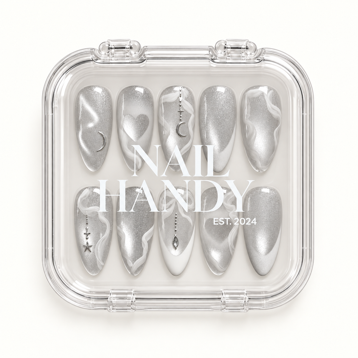 Closed clear case with white Nail Handy lettering displaying ten coordinated silver and white nails on a pale background.
