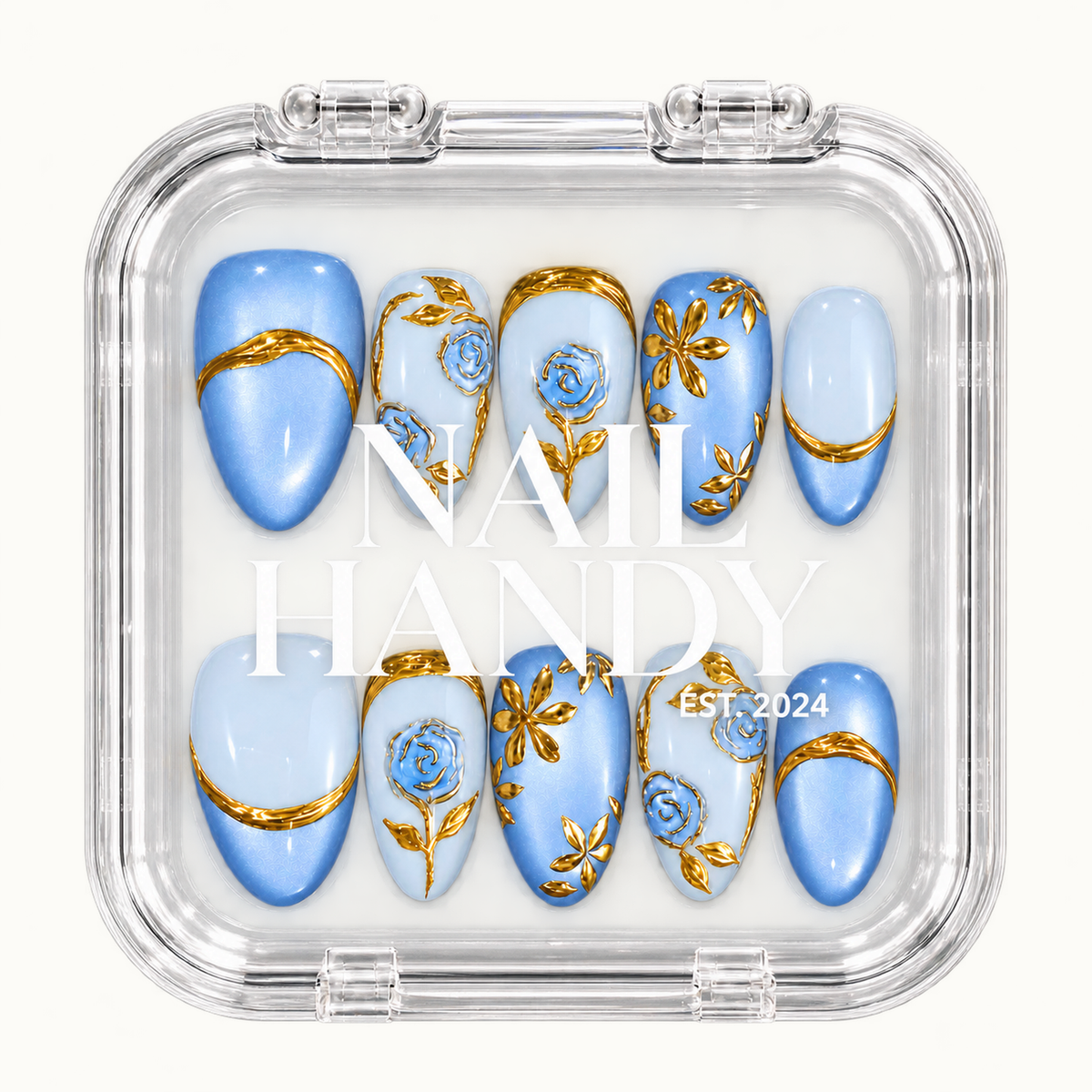 Closed clear Nail Handy case displaying ten blue and pale blue nails with gold botanical details, arranged in two rows beneath white branding.