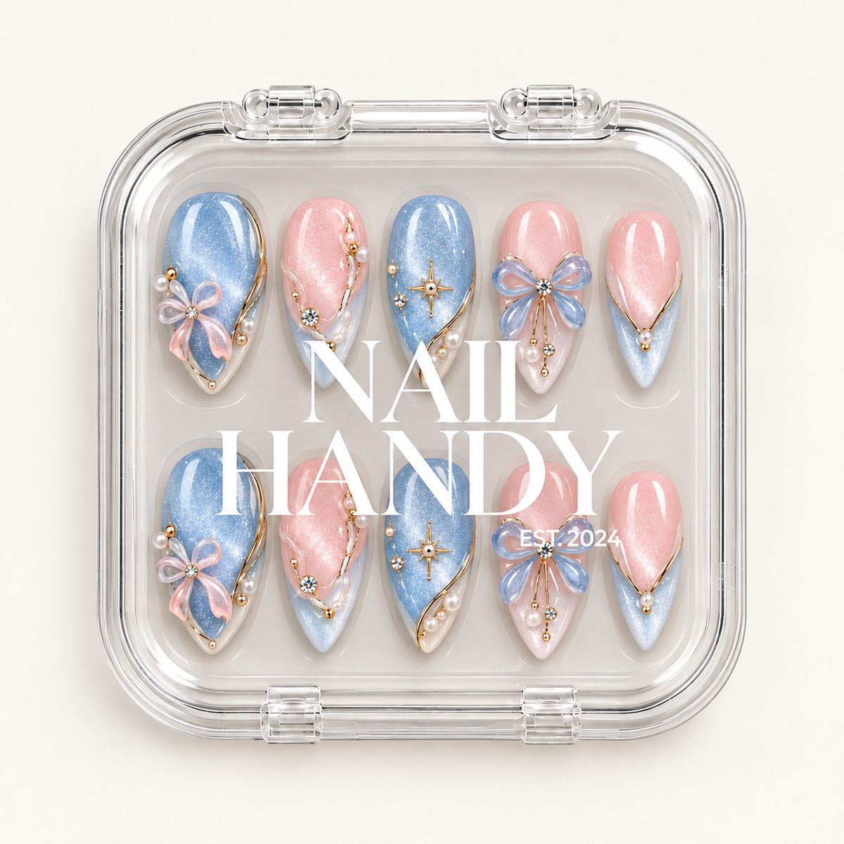 Closed clear Nail Handy case displaying ten pink and icy blue decorated nails in two rows beneath white branding on the lid.