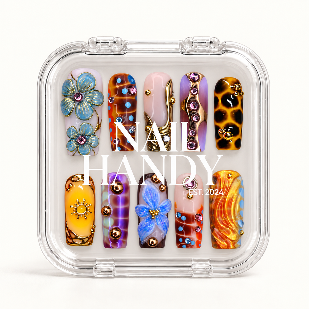 Closed clear Nail Handy case displaying ten decorated nails in two rows beneath white branding.