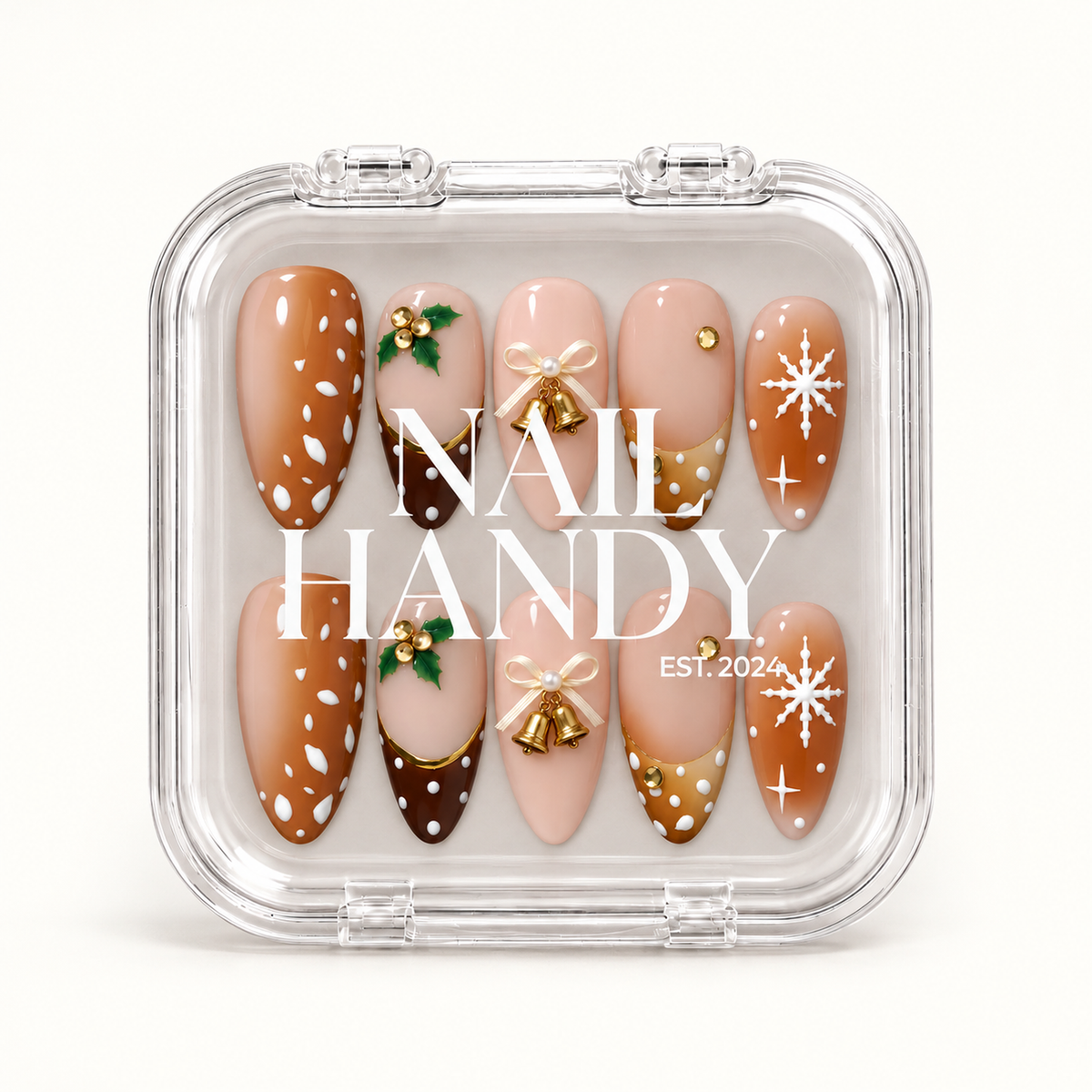 Closed clear Nail Handy case displaying ten coordinated caramel, blush, and brown Christmas nails with holly, bows, gold bells, and snowflakes.