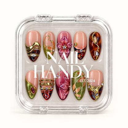 Closed clear Nail Handy case displaying ten coordinated floral and patterned nails beneath white branding on the lid.