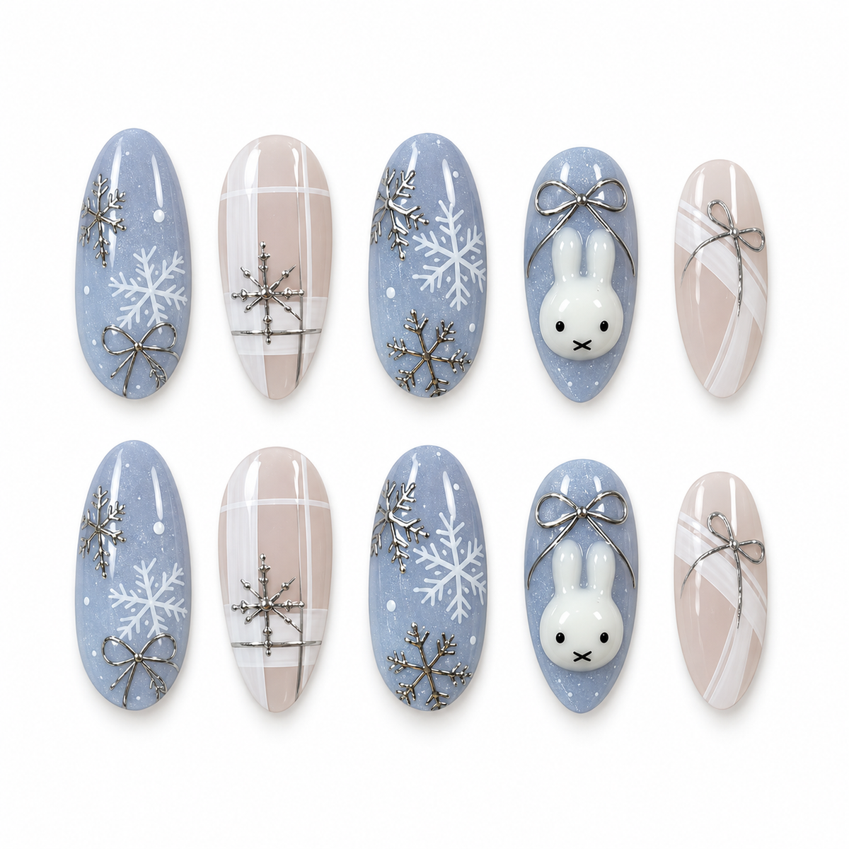 Ten Snowbound Bunny nails arranged in two rows, showing blue snowflake and bunny designs beside nude plaid and bow accents.