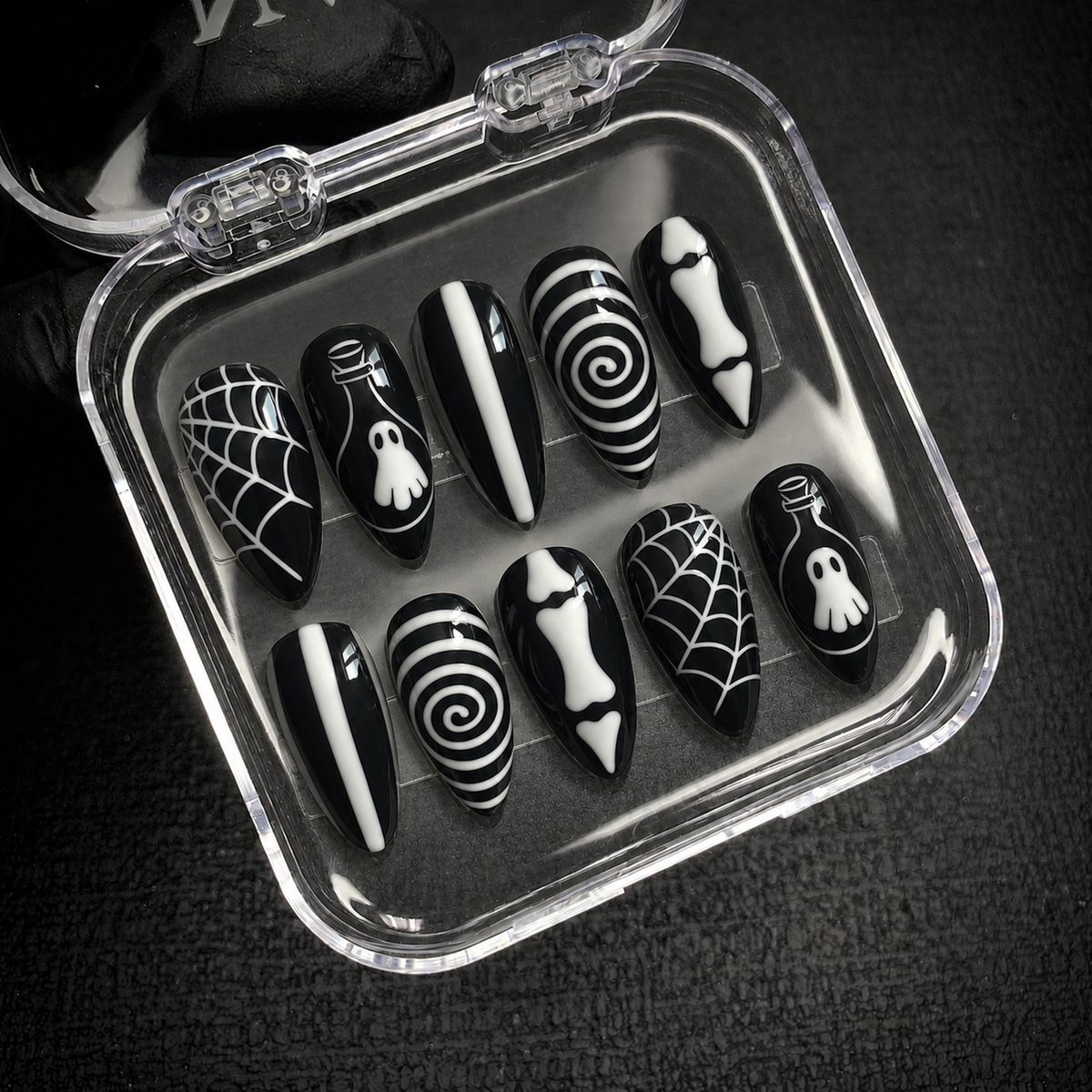 Open Nail Handy package box with the Midnight Spirit Web press-on nail set.
