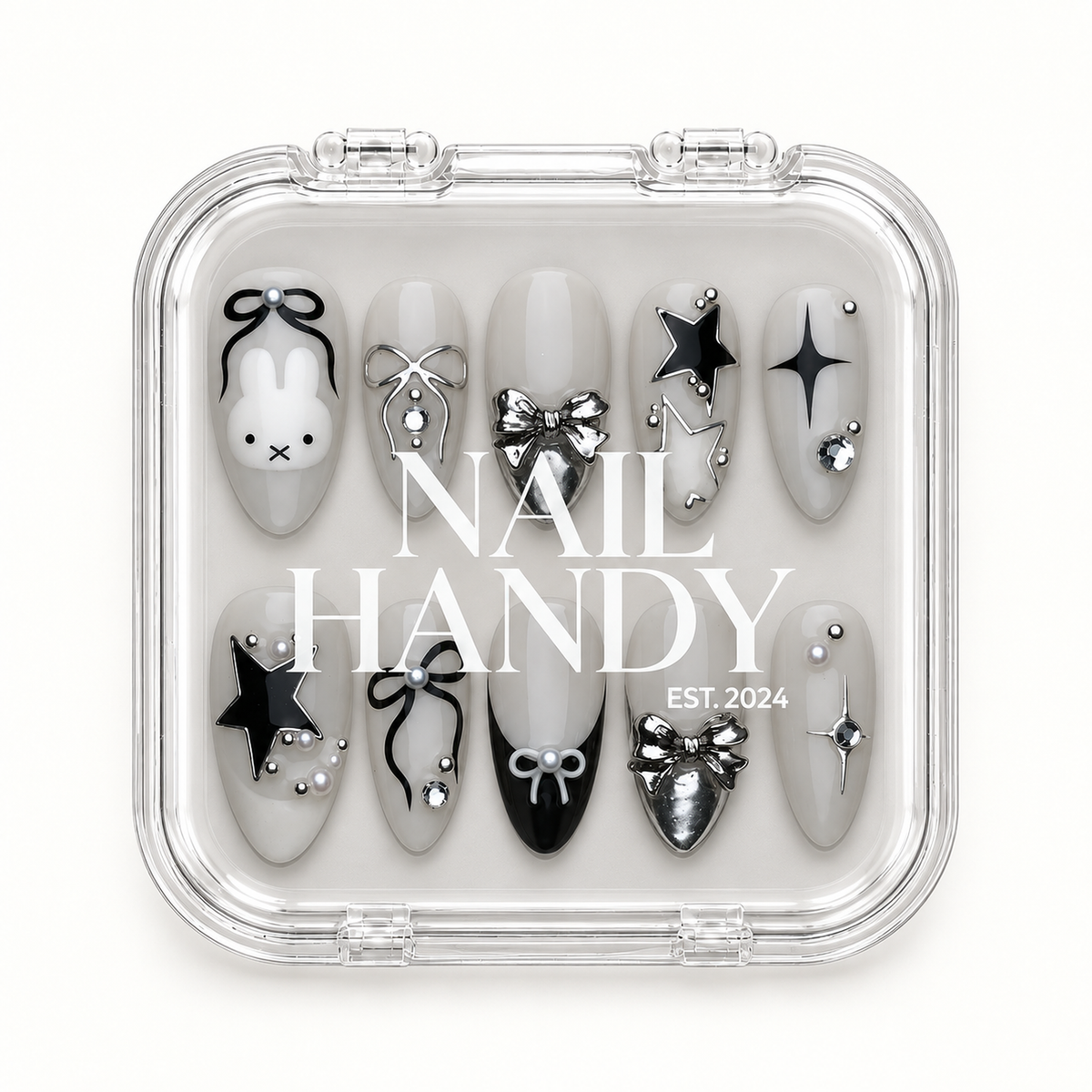 Clear Nail Handy case displaying ten greige bunny, bow, and star nails against a light background.