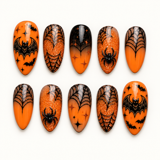 Ember Web orange and black press-on nail set with bats, spiders, glitter, and spiderweb artwork