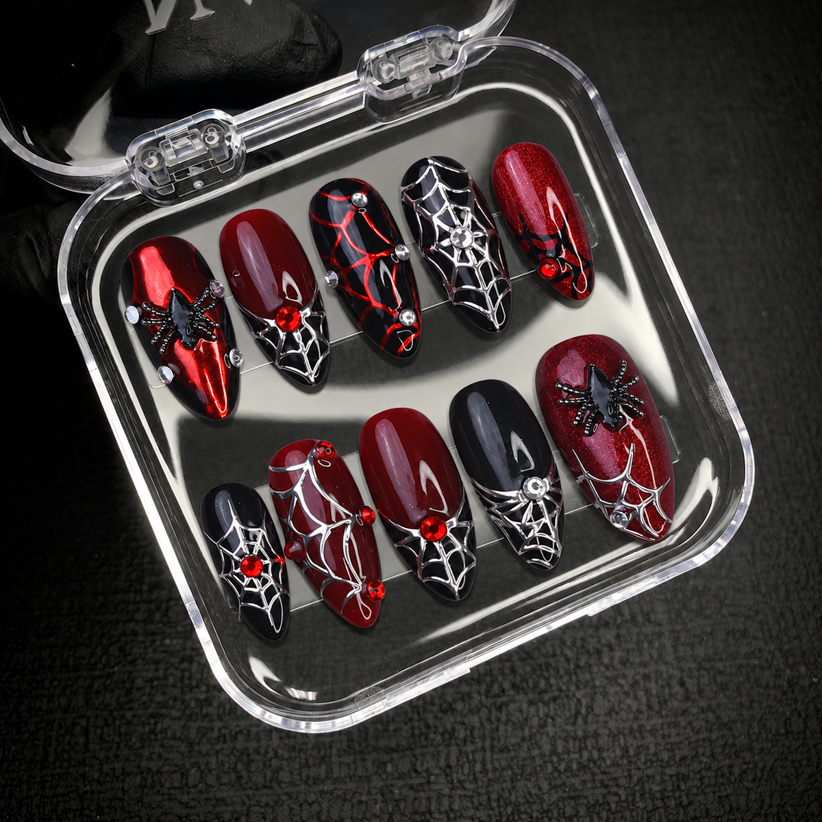 Open Nail Handy package displaying the Crimson Web press-on nail set and included presentation materials.
