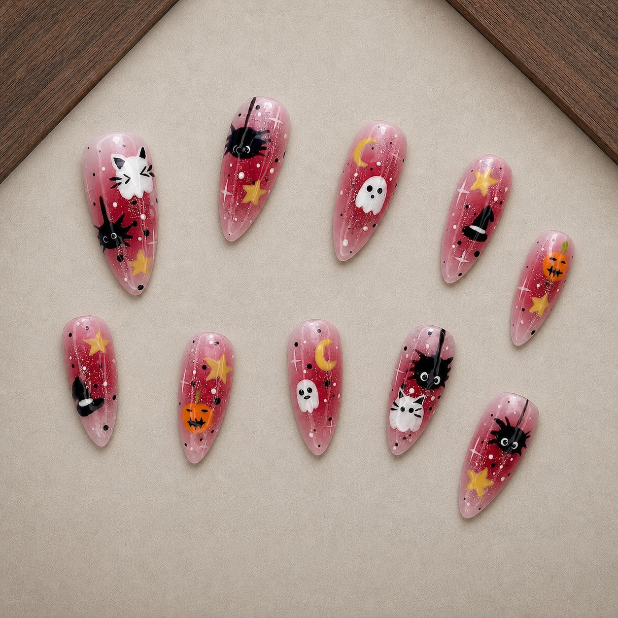 Berry Hex Halloween press-on nail set displayed in a walnut tray — almond shape