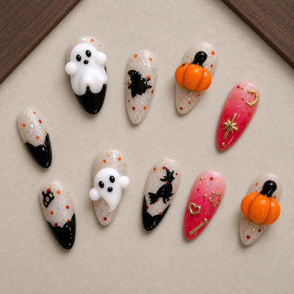 Broomstick Boo Halloween press-on nail set displayed in a walnut tray — almond shape