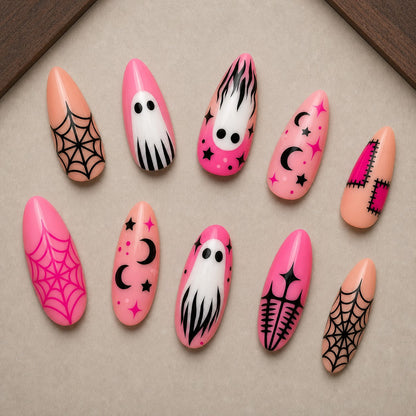 Bubble Hex Halloween press-on nail set displayed in a walnut tray — almond shape