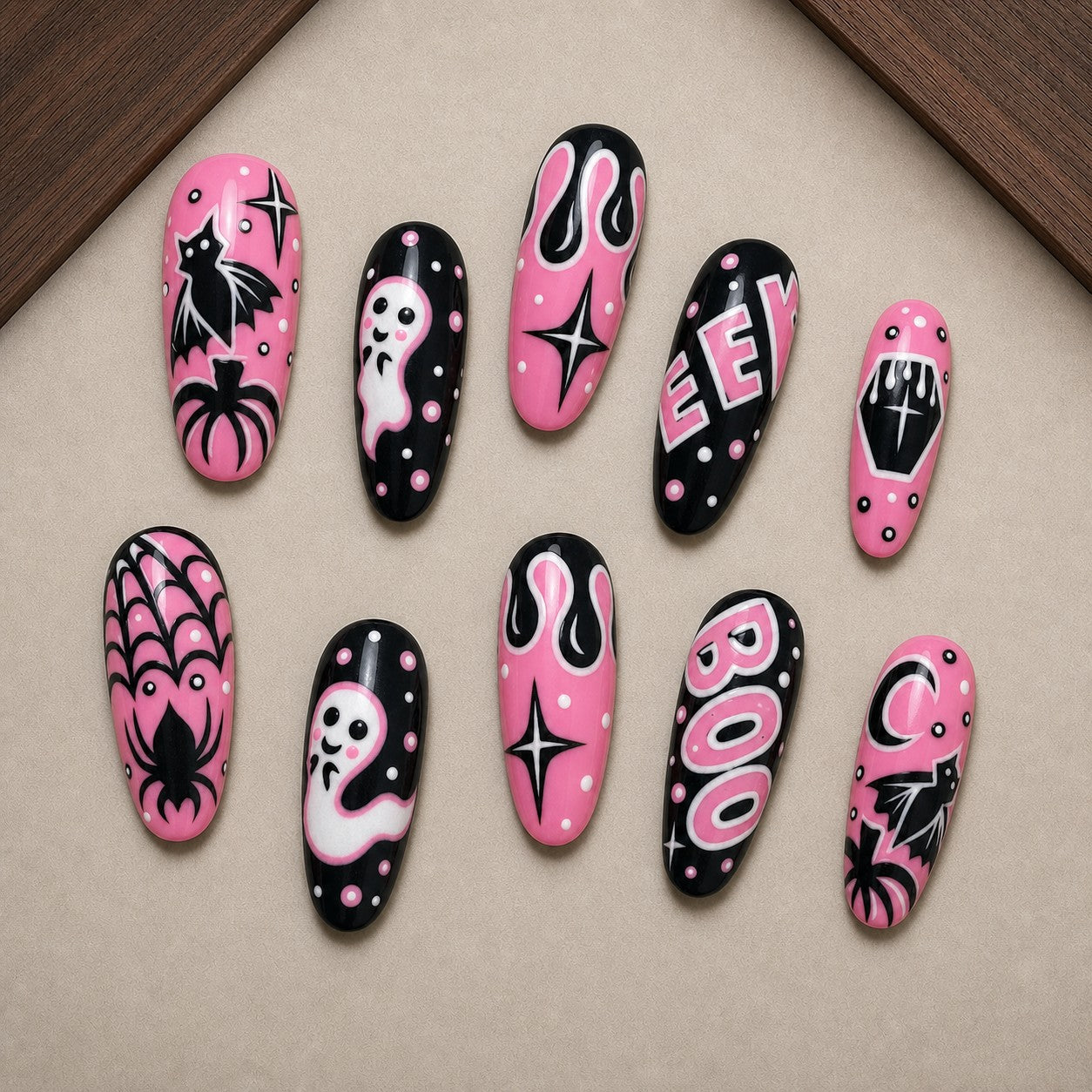 Bubblegum Boo Halloween press-on nail set displayed in a walnut tray — almond shape