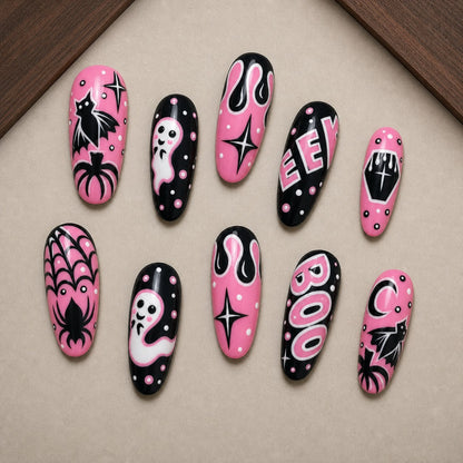 Bubblegum Boo Halloween press-on nail set displayed in a walnut tray — almond shape