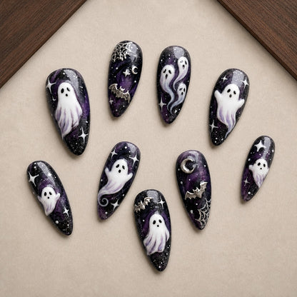 Celestial Haunt Halloween press-on nail set displayed in a walnut tray — almond shape