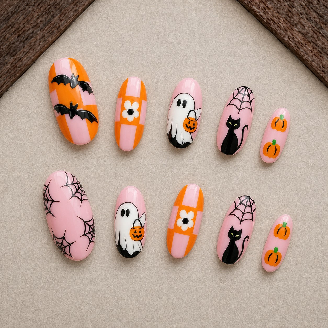 Checker Boo Halloween press-on nail set displayed in a walnut tray — almond shape