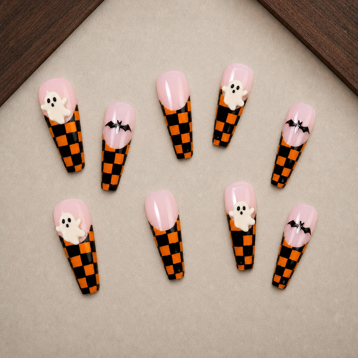Checkered Phantom Halloween press-on nail set displayed in a walnut tray — coffin shape