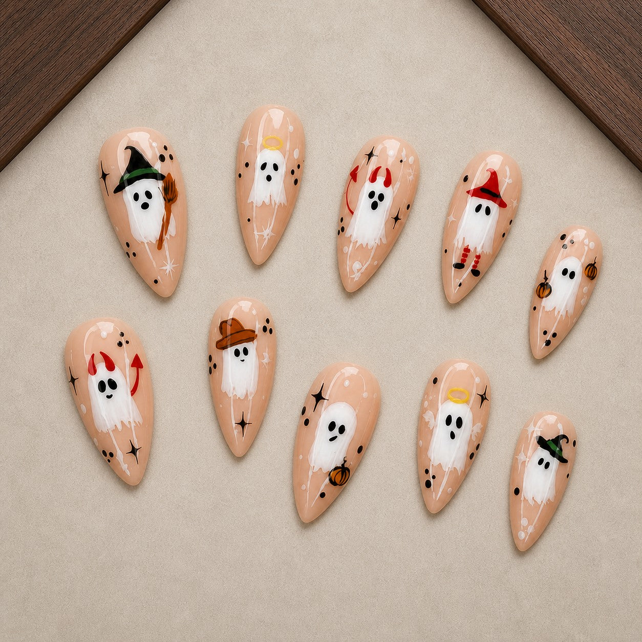 Costume Party Boo Halloween press-on nail set displayed in a walnut tray — almond shape