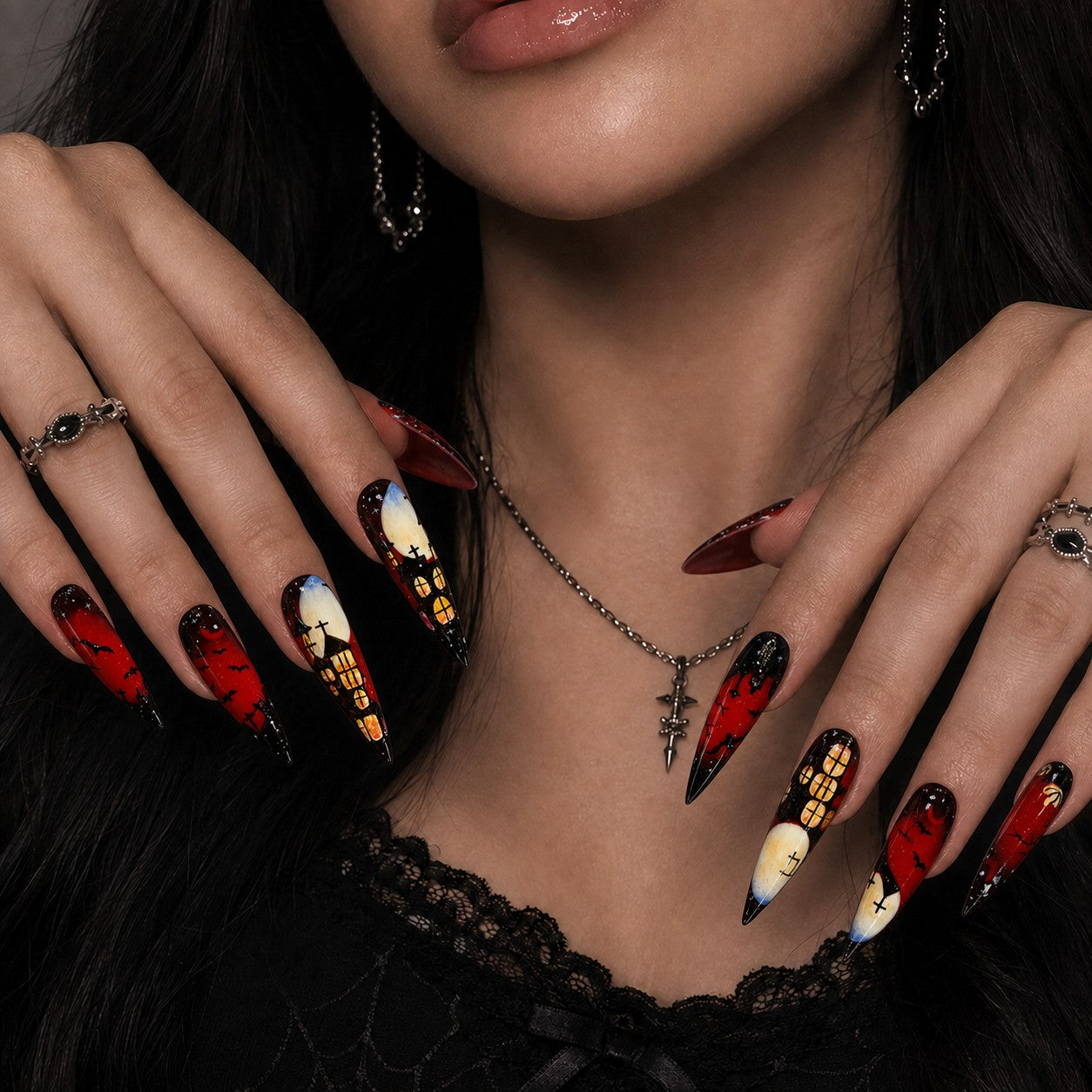 Crimson Keep Halloween press-on nails in stiletto shape worn on model hand — vampire, haunted house, bat nail art