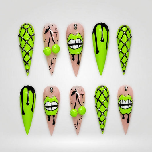 Ten coordinated neon-lime, black, and nude graphic press-on nails arranged on a greige catalog background.