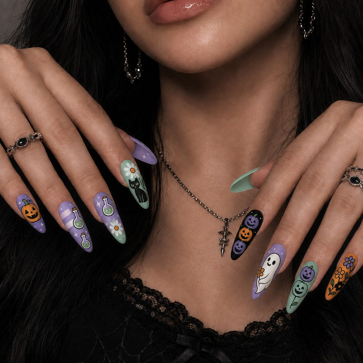 Daisy Boo Pastel Halloween press-on nails in almond shape worn on model hand — pumpkin, ghost, pastel nail art