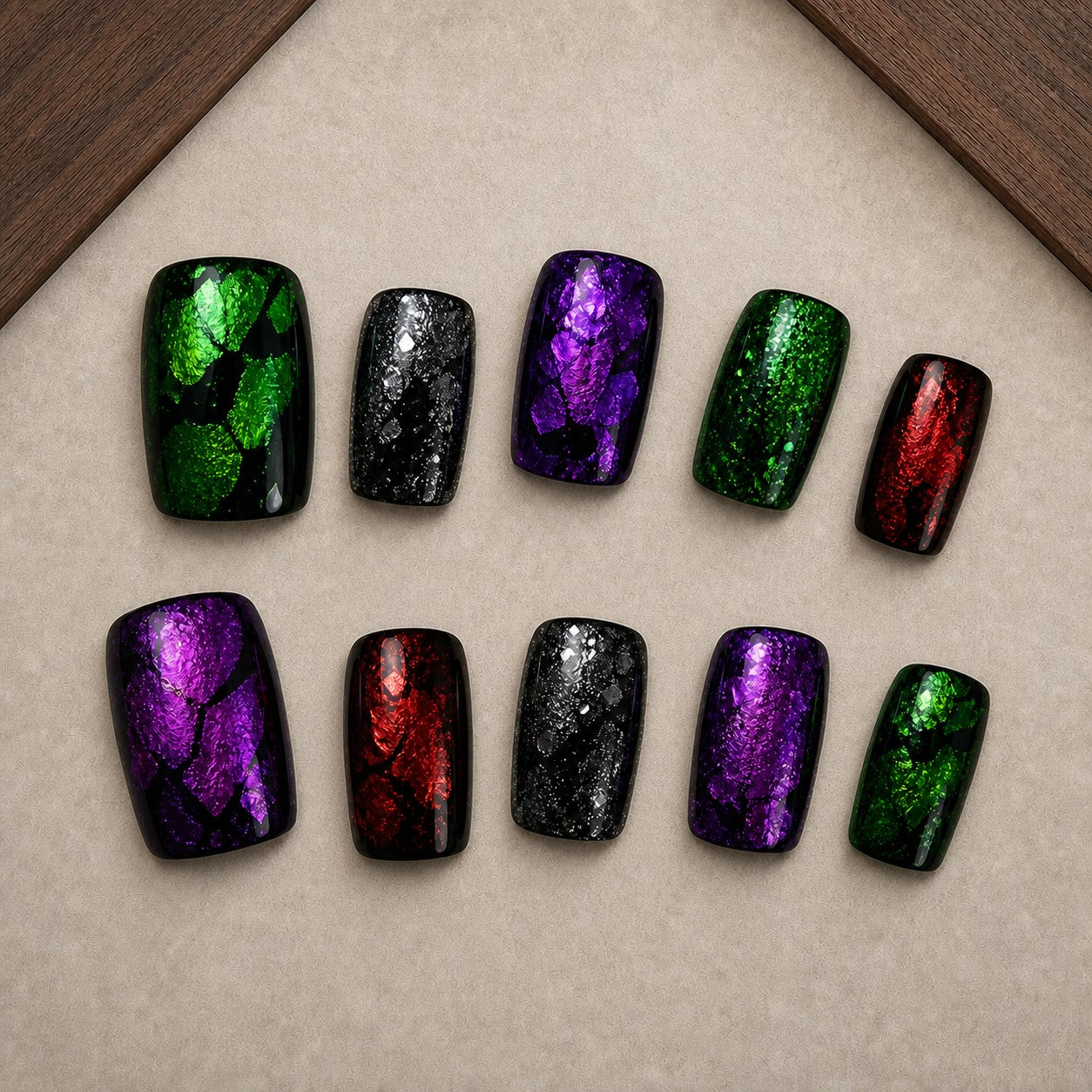 Gemstone Wing Halloween press-on nail set displayed in a walnut tray — square shape
