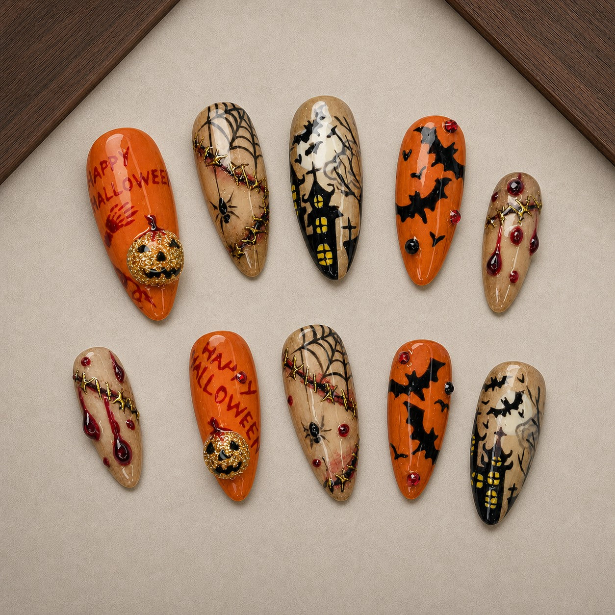 Happy Haunt Halloween press-on nail set displayed in a walnut tray — almond shape