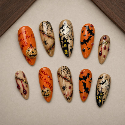Happy Haunt Halloween press-on nail set displayed in a walnut tray — almond shape