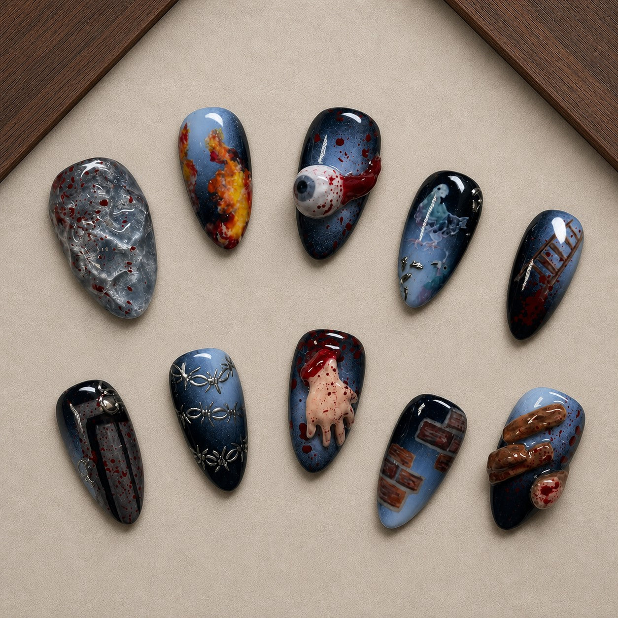 Horror Reel Halloween press-on nail set displayed in a walnut tray — almond shape