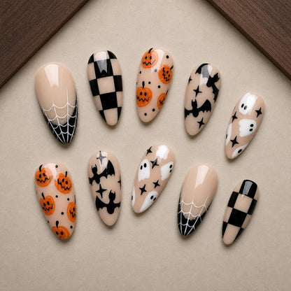 Latte Boo Halloween press-on nail set displayed in a walnut tray — almond shape
