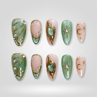 Emerald Moon cat eye press-on nails with green glitter and celestial charms