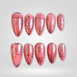 Crimson Luxe press-on nails — deep red with 3D hearts on almond nails