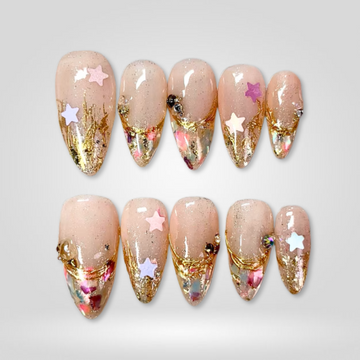 Celestial Dream gold glitter press-on nails on almond shape