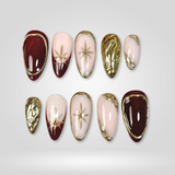Golden Hour press-on nails with burgundy and gold chrome finish