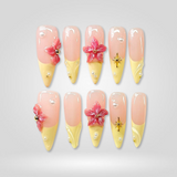 Sun Petal press-on nails with yellow French tips and 3D flowers