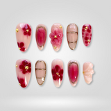 Cherry Glow press-on nails — red ombré with 3D floral and gold frames