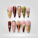 Wild Luxe press-on nails — gold metallic tortoise shell with 3D florals