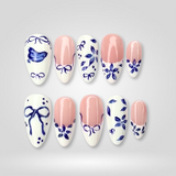 Ceramic Blue hand-painted press-on nails with blue floral motifs and bird