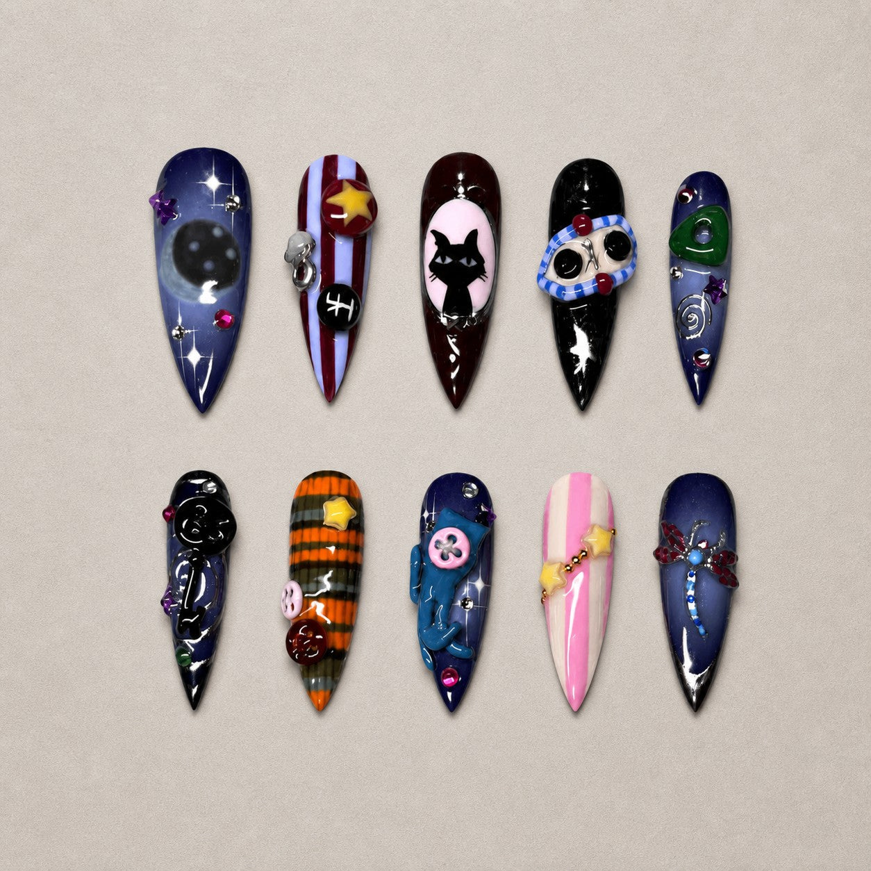 Full set of 10 stiletto press-on nails — Midnight Curio Halloween nail art with celestial, black cat, whimsical