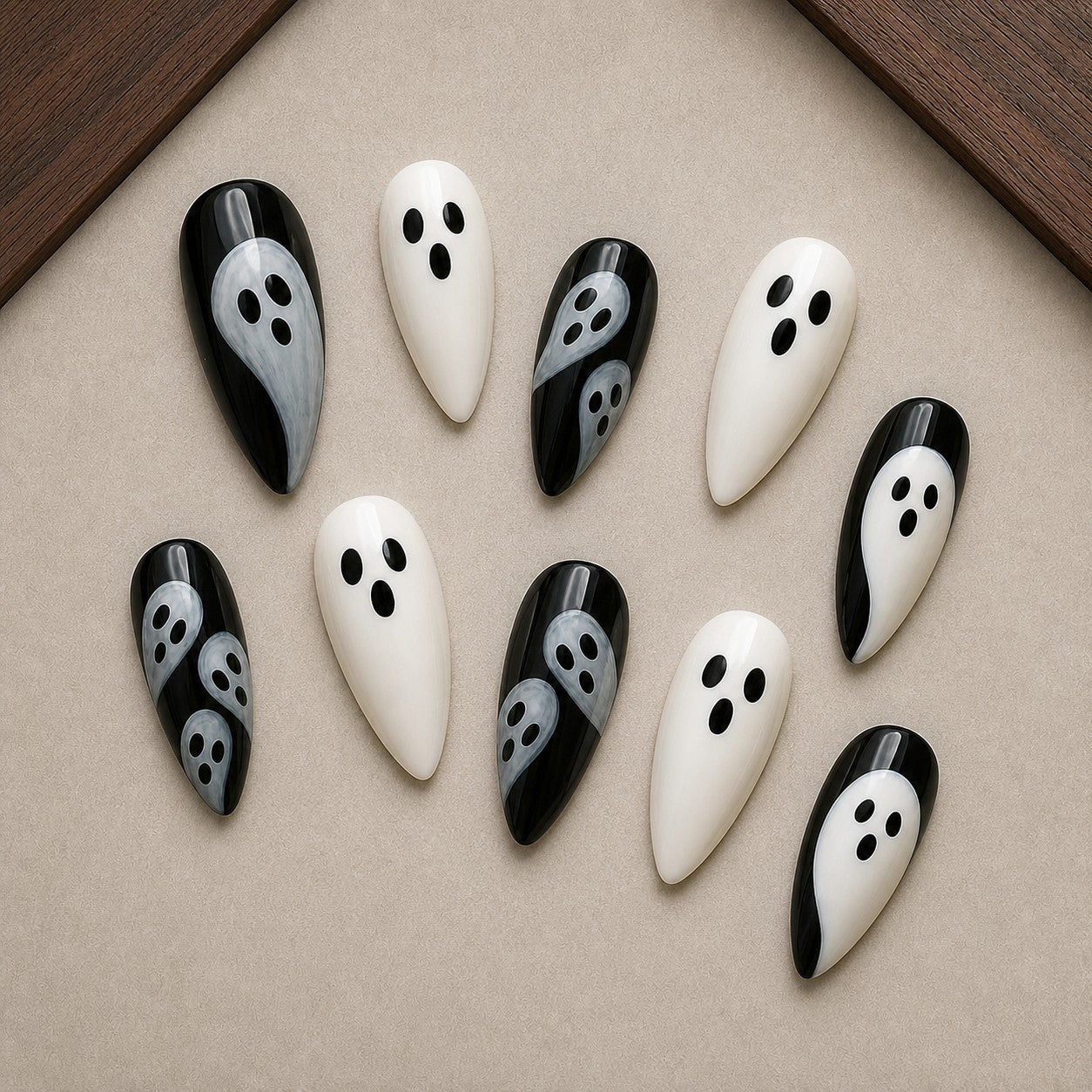 Mod Ghost Halloween press-on nail set displayed in a walnut tray — almond shape
