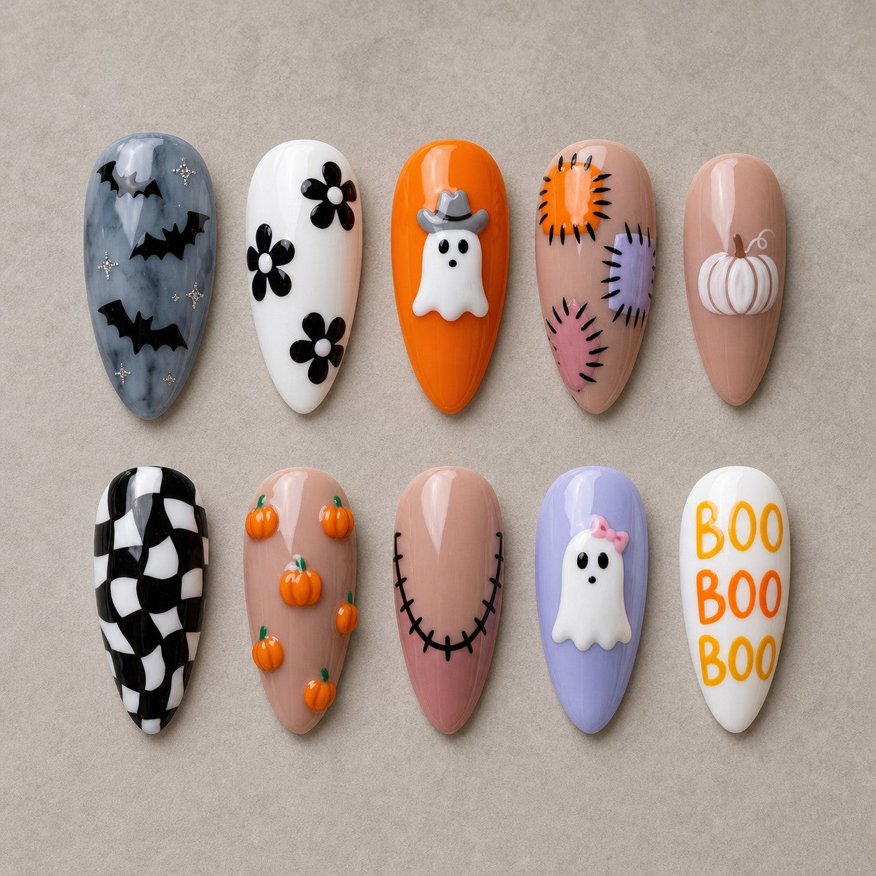 Full set of 10 almond press-on nails — Patchwork Boo Halloween nail art with ghost, pumpkin, checkerboard