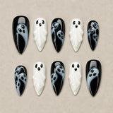 Phantom Noir almond nails with sculpted 3D ghost faces and black and white design