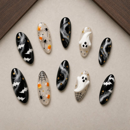 Phantom Smoke Halloween press-on nail set displayed in a walnut tray — almond shape