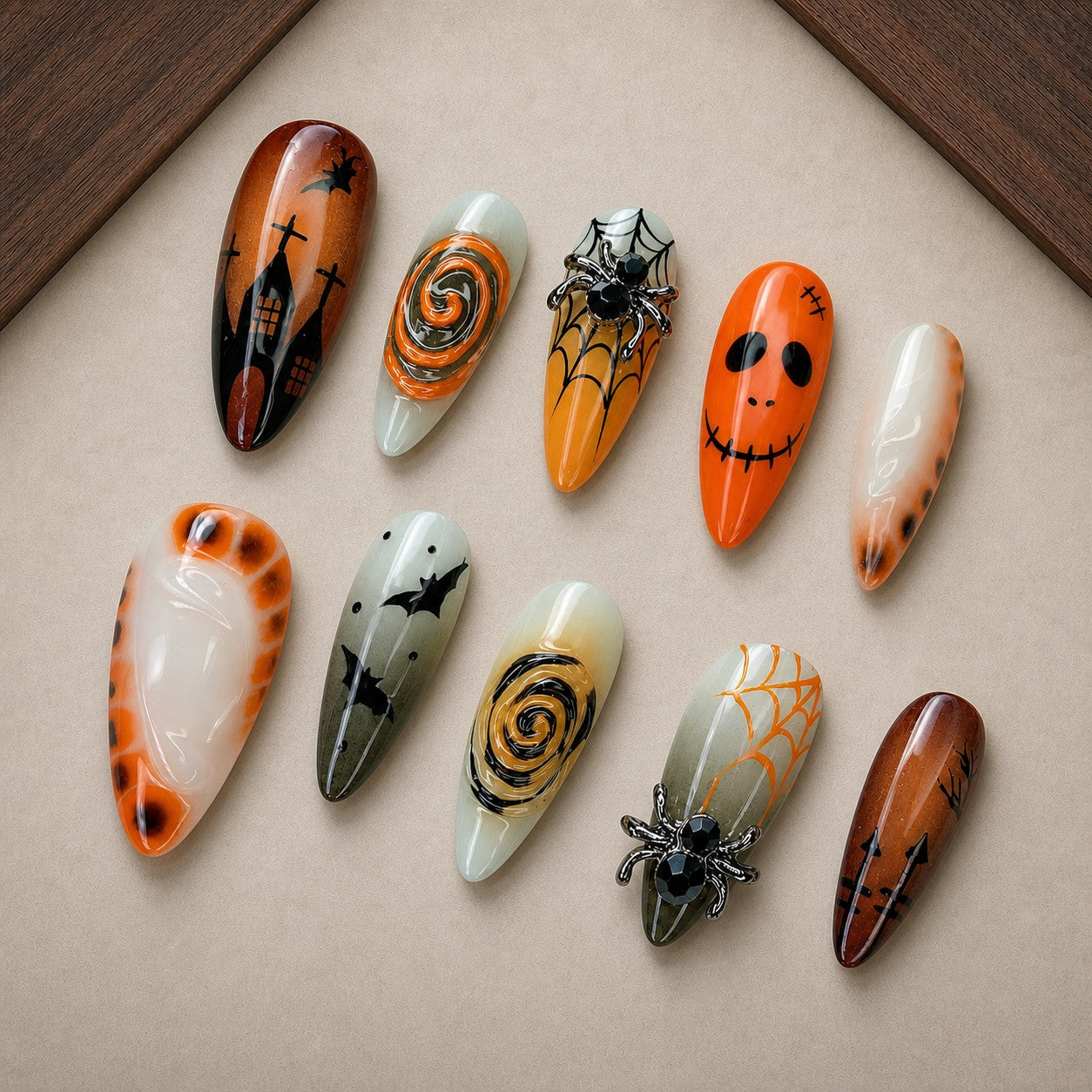 Storybook Spell Halloween press-on nail set displayed in a walnut tray — almond shape