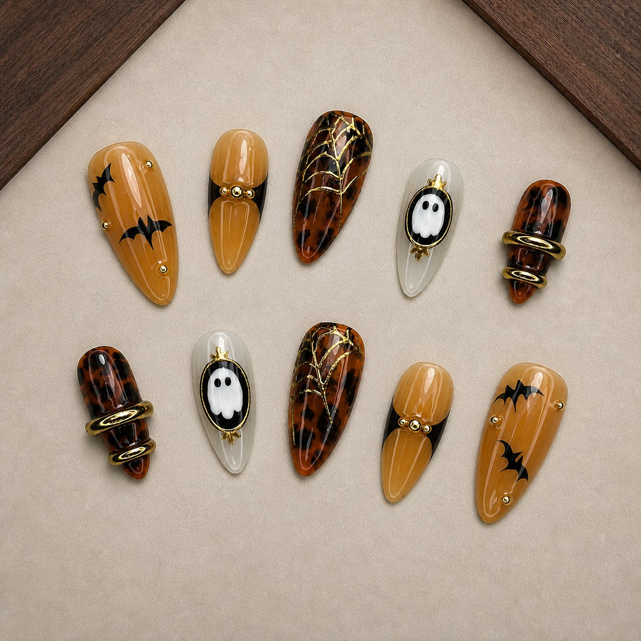 Tortoise Twilight Halloween press-on nail set displayed in a walnut tray — almond shape