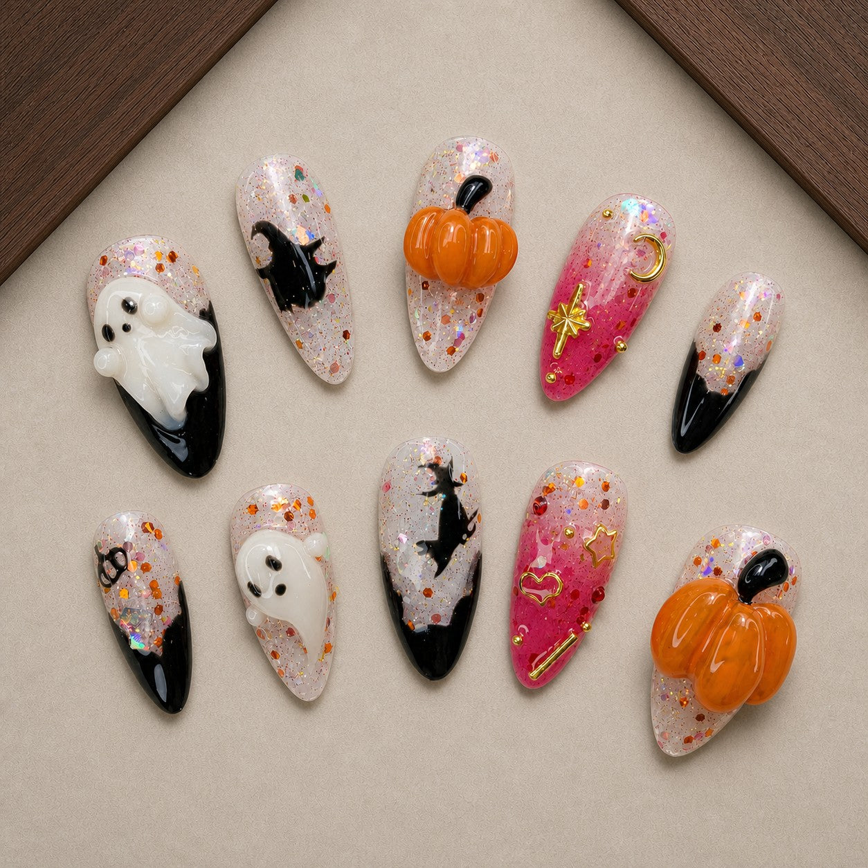Twilight Charms Halloween press-on nail set displayed in a walnut tray — almond shape